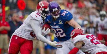 NFL players in full action on the field during a high-stakes game — 2026 NFL Draft rookies creating sharp betting value on props and futures